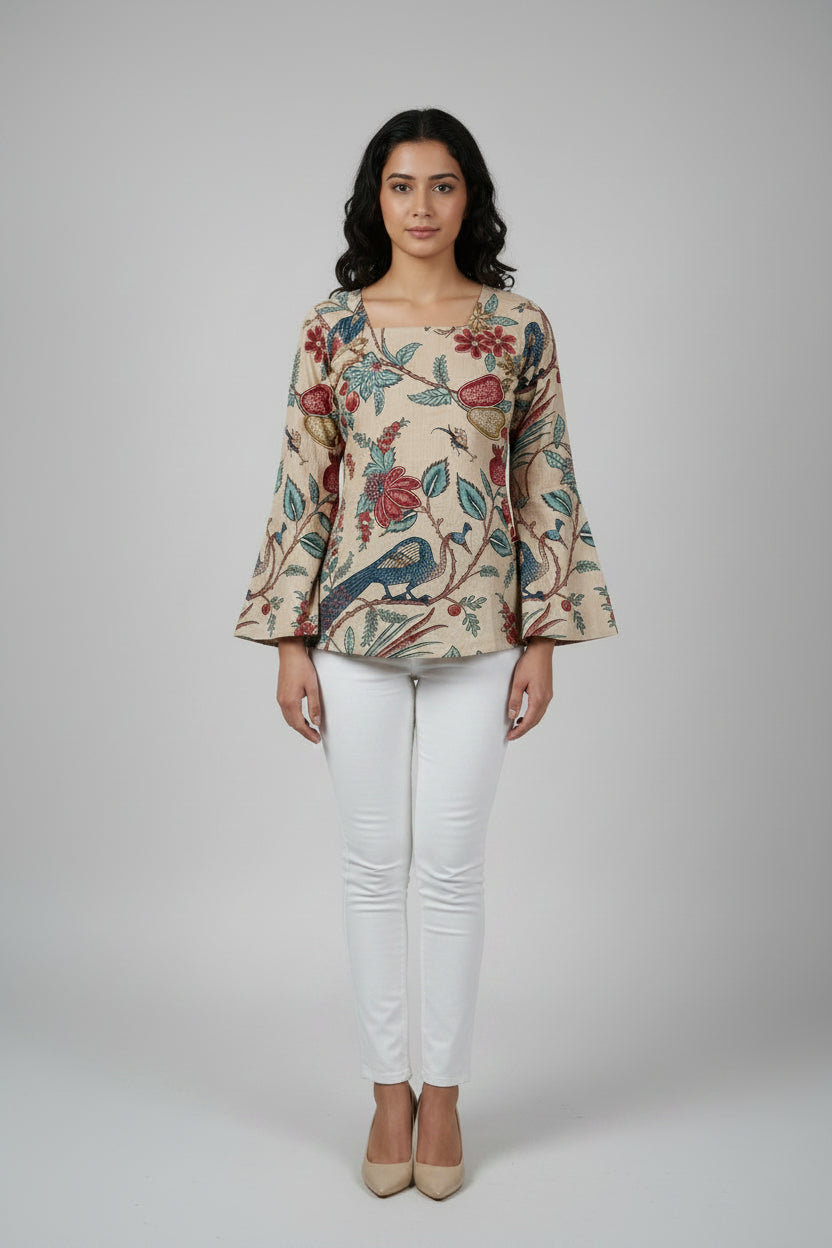  wearing a floral and bird patterned top with a white background
