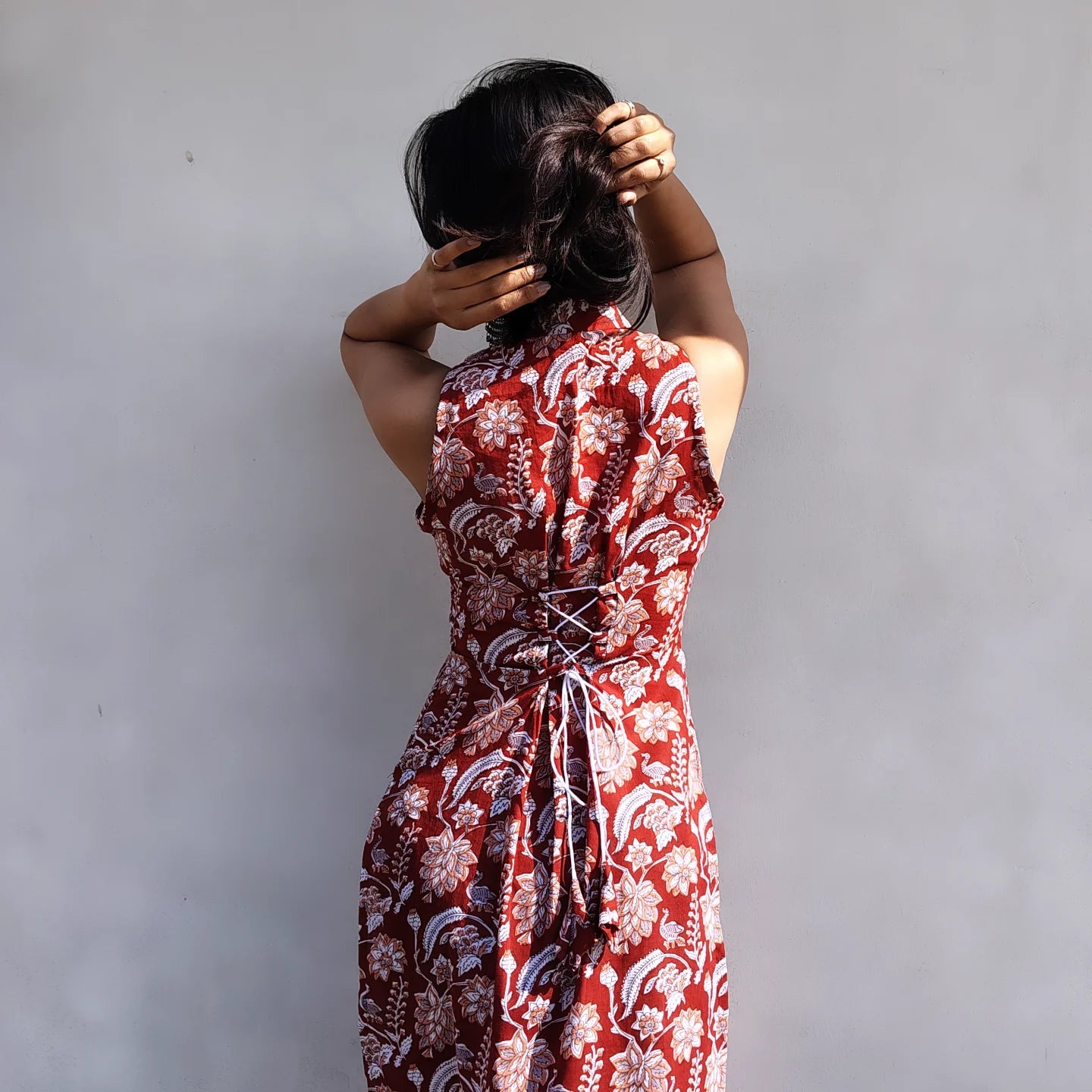 Person wearing a halter neck long kurti against a plain background