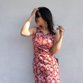 Woman wearing a halter neck long kurti a white background
